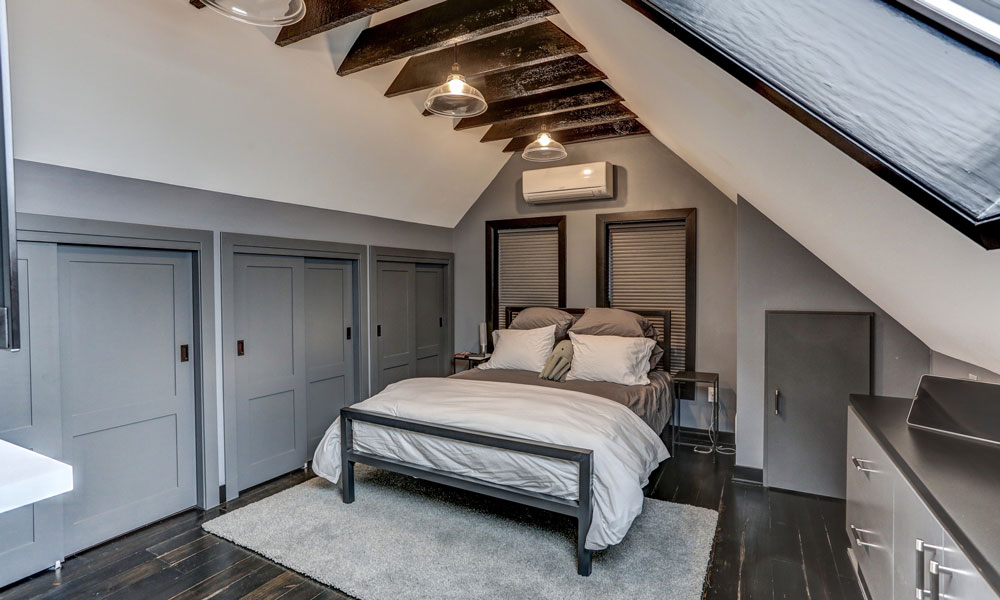 bedroom with plank flooring