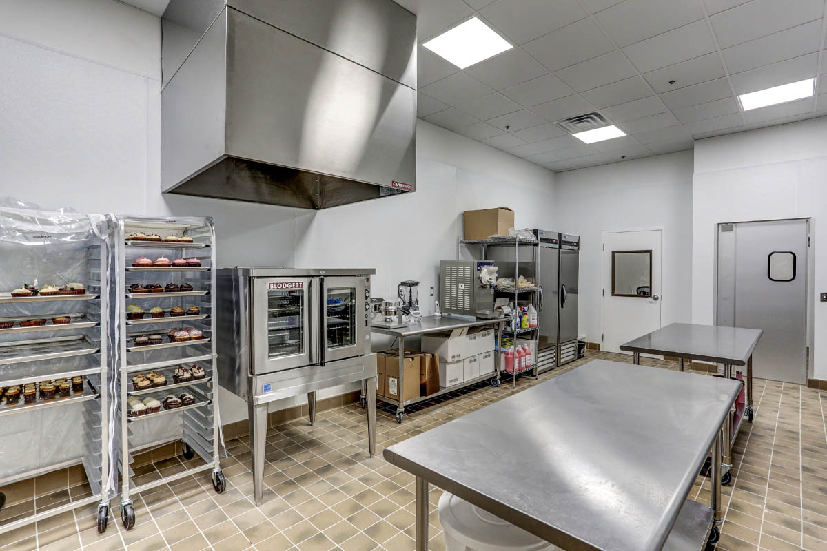 the interior of a small commercial kitchen in a bakery