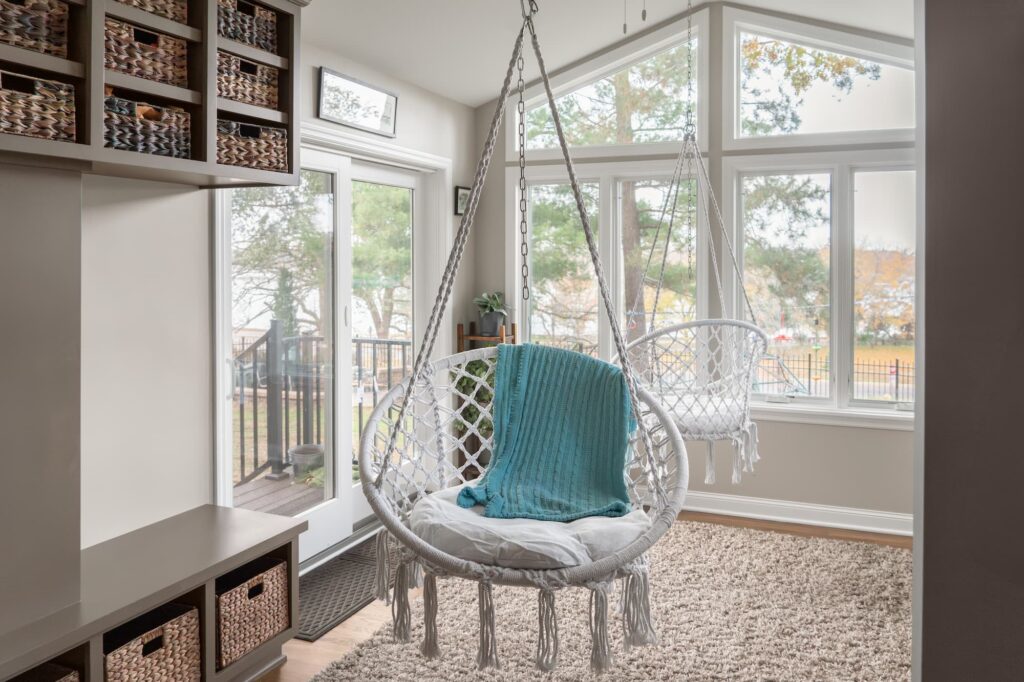 sunroom with a hanging chair