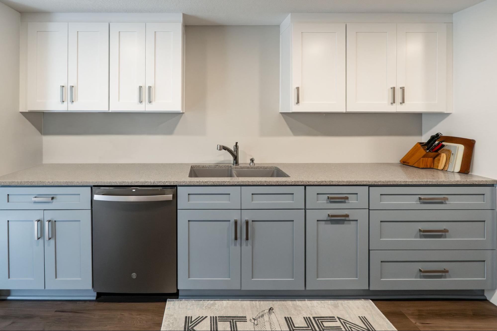 a galley-style kitchen with light blue cabinets