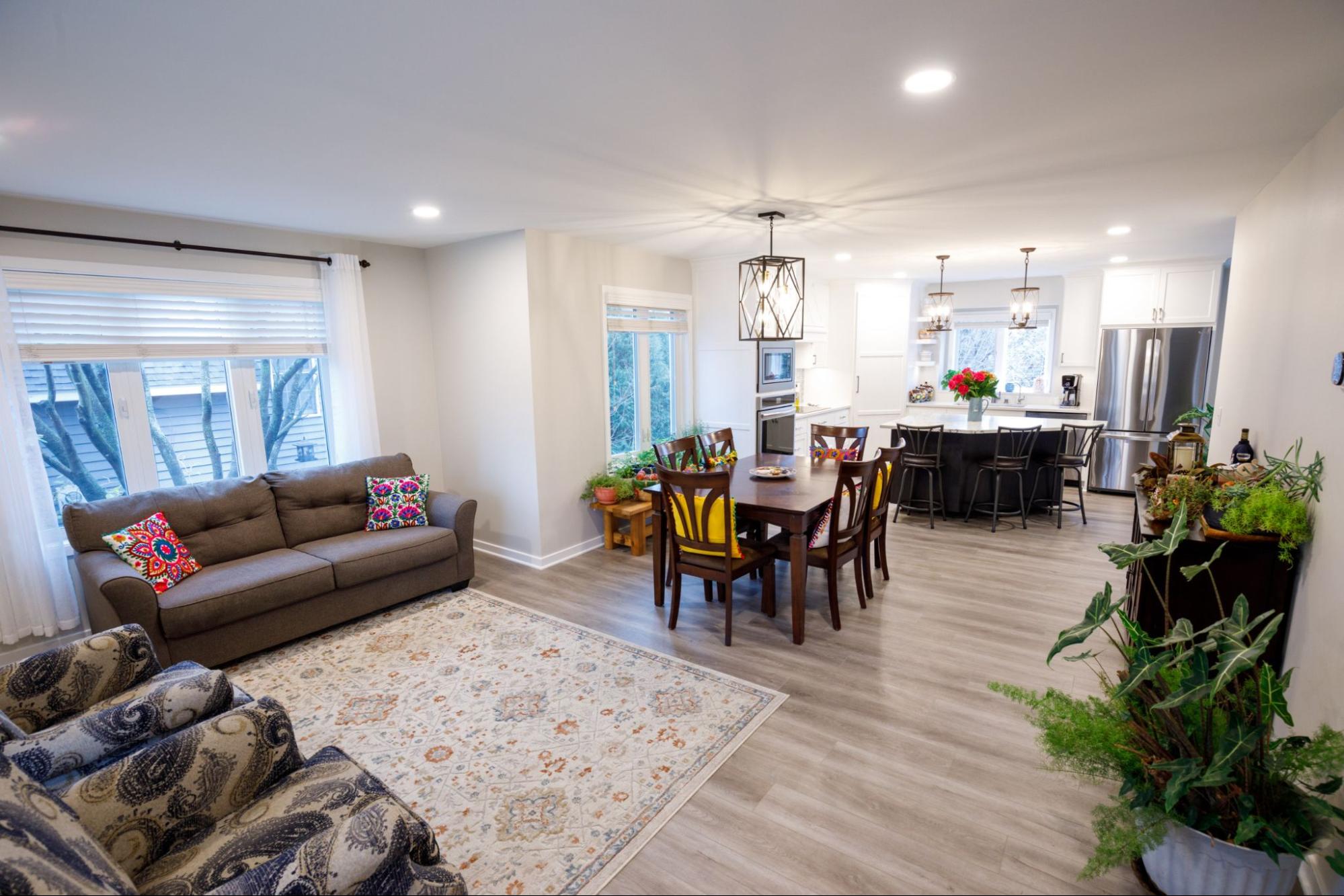 view of an open concept living room, dining, and kitchen area