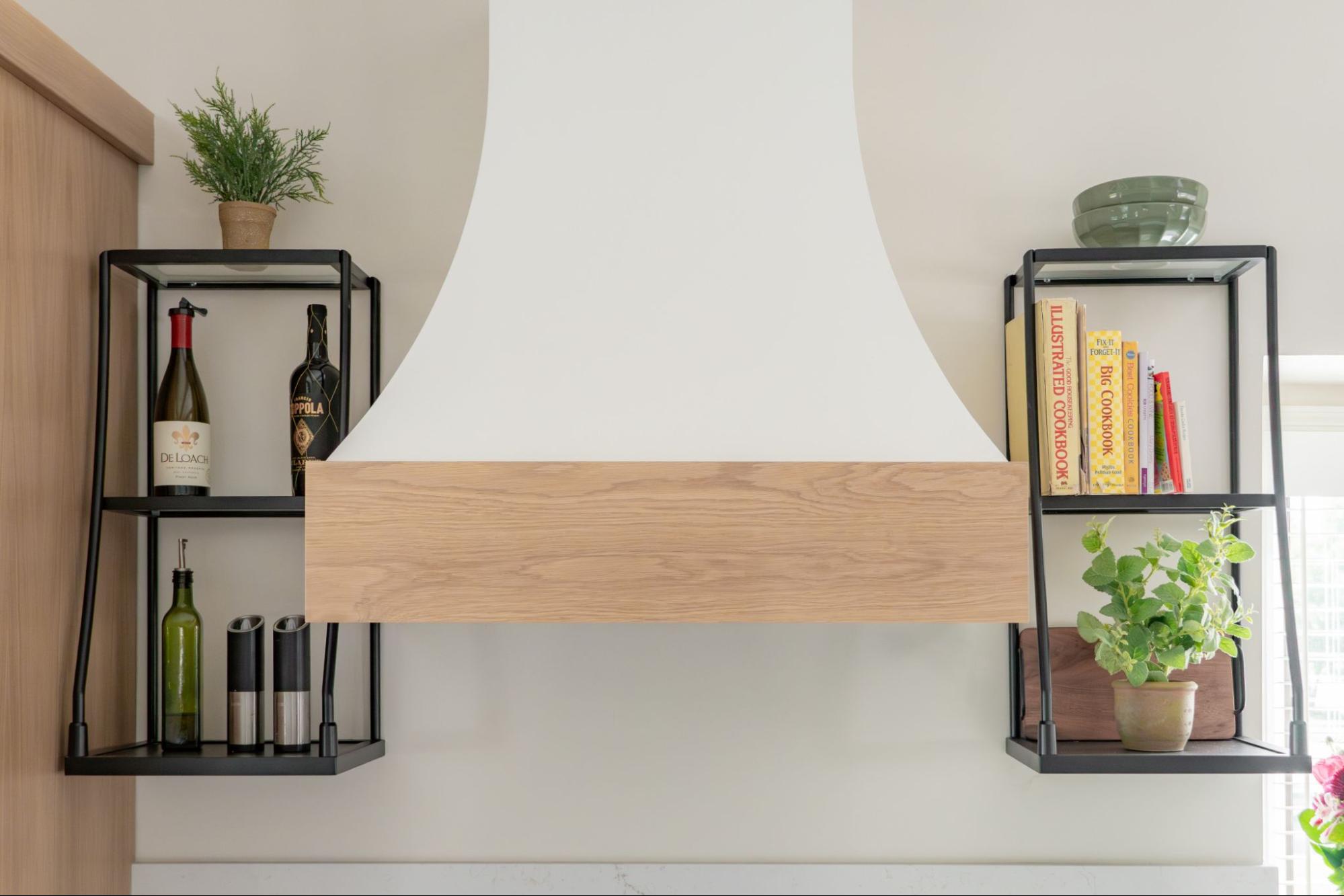 two open shelves inside a kitchen, on either side of a range hood