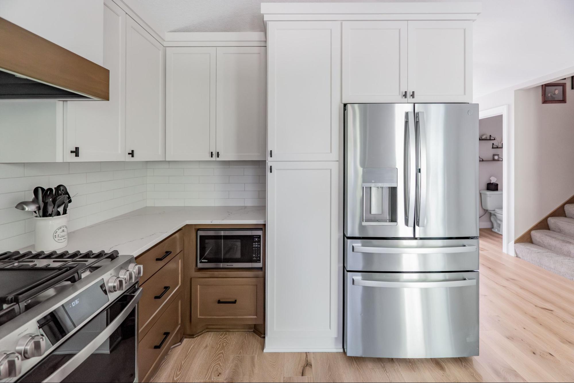 a kitchen with floor-to-ceiling cabinets