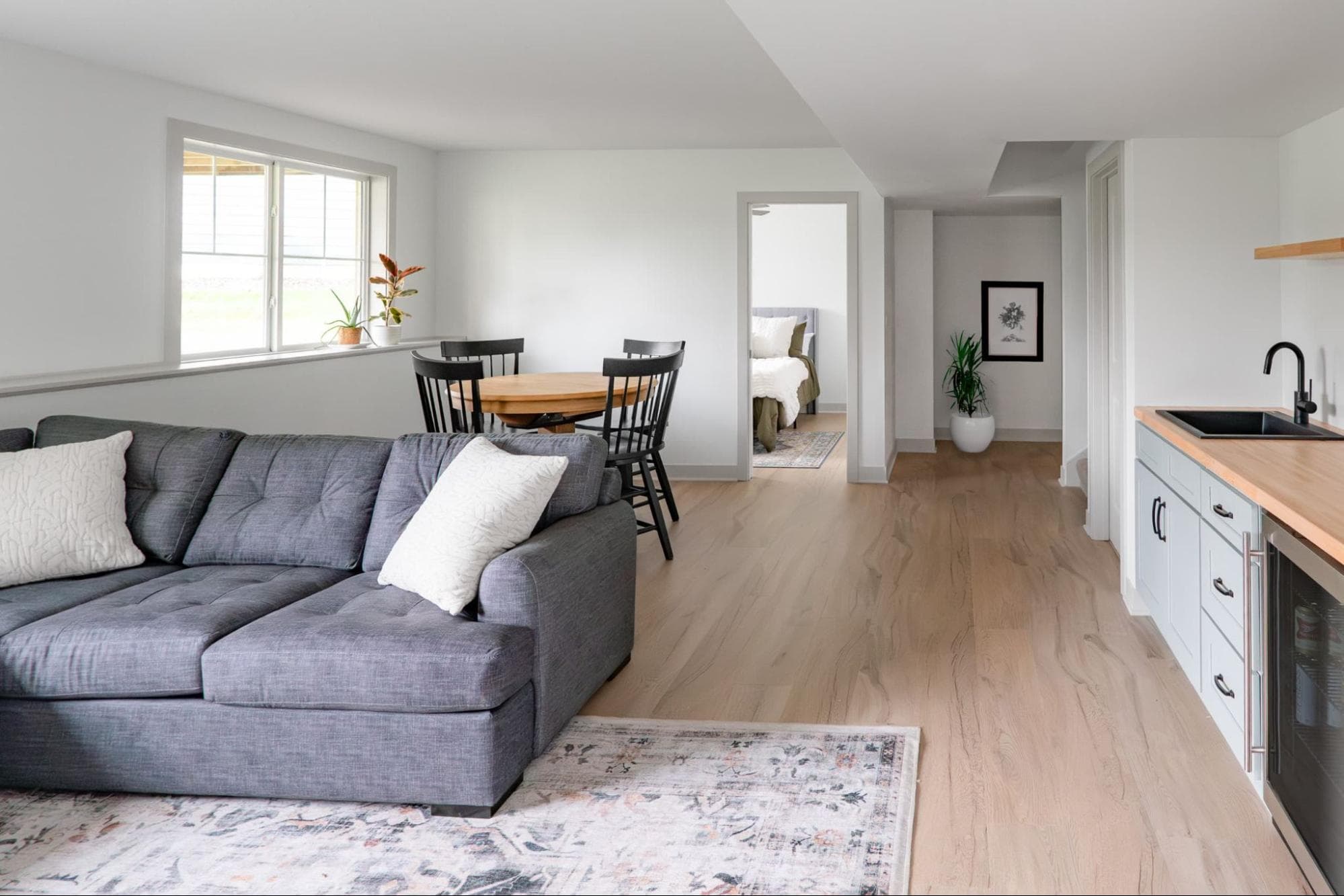 basement gathering area with view into bedrooms