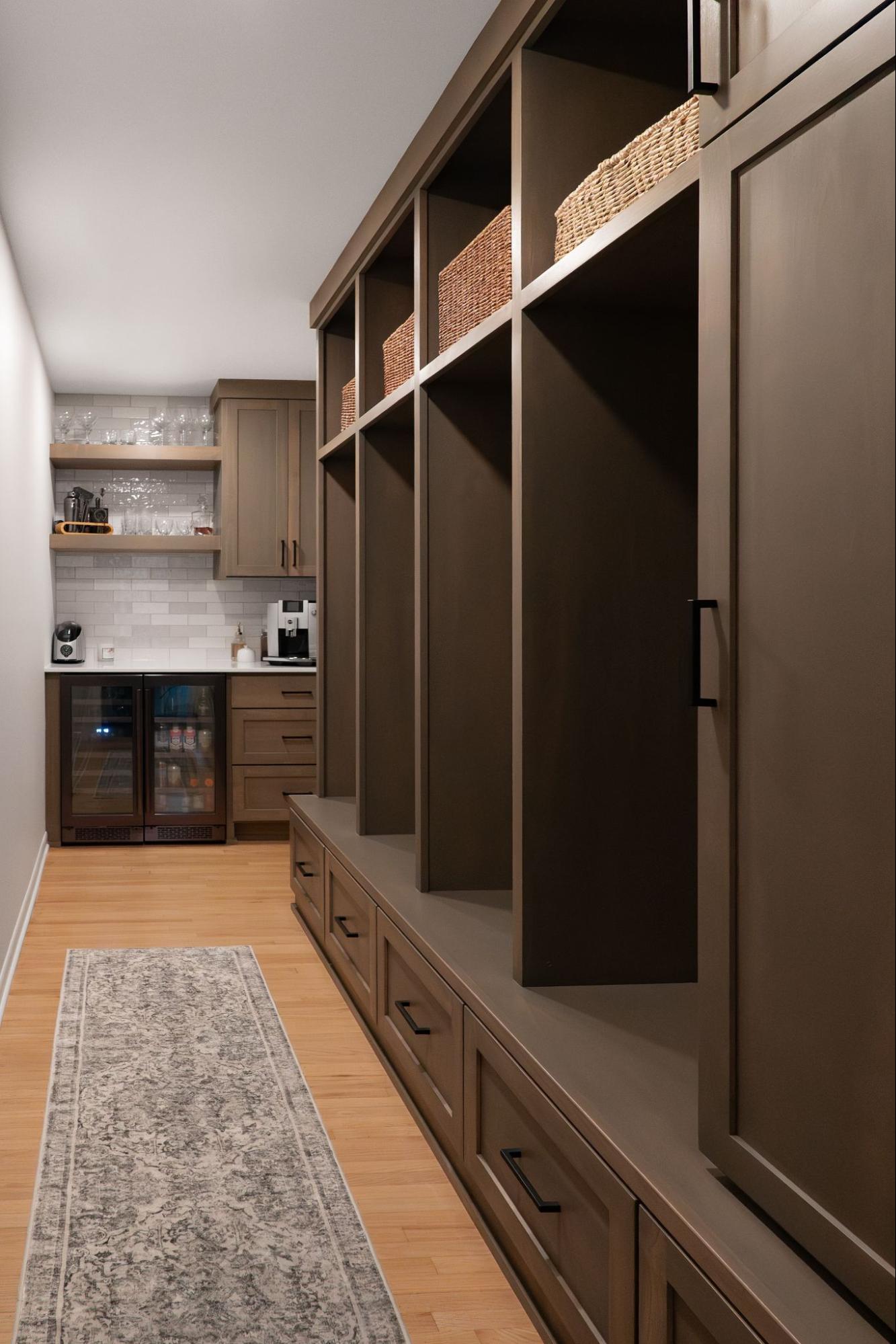 a mudroom with floor to ceiling storage